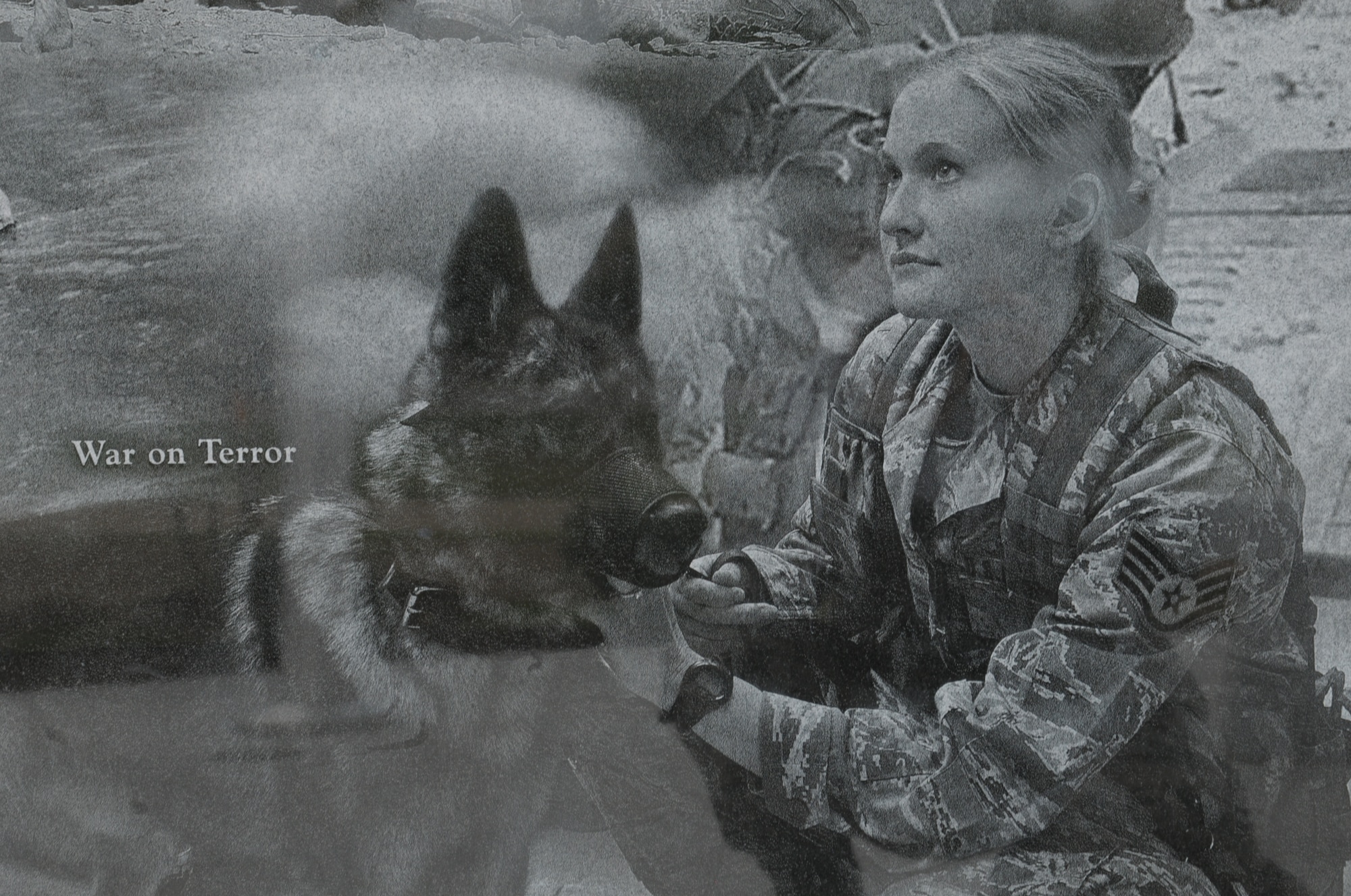 A image of a handler and her dog during War on Terror was part of a collection that create a montage that is etched onto the face of the Military Working Dog Teams’ National Monument which was revealed Oct. 28, 2013 at Joint Base San Antonio-Lackland, Texas. The Department of Defense Military Working Dog Program is located at JBSA-Lackland where teams have been trained since 1958. (U.S. Air Force photo by Airman 1st Class Krystal M. Jeffers/Released)