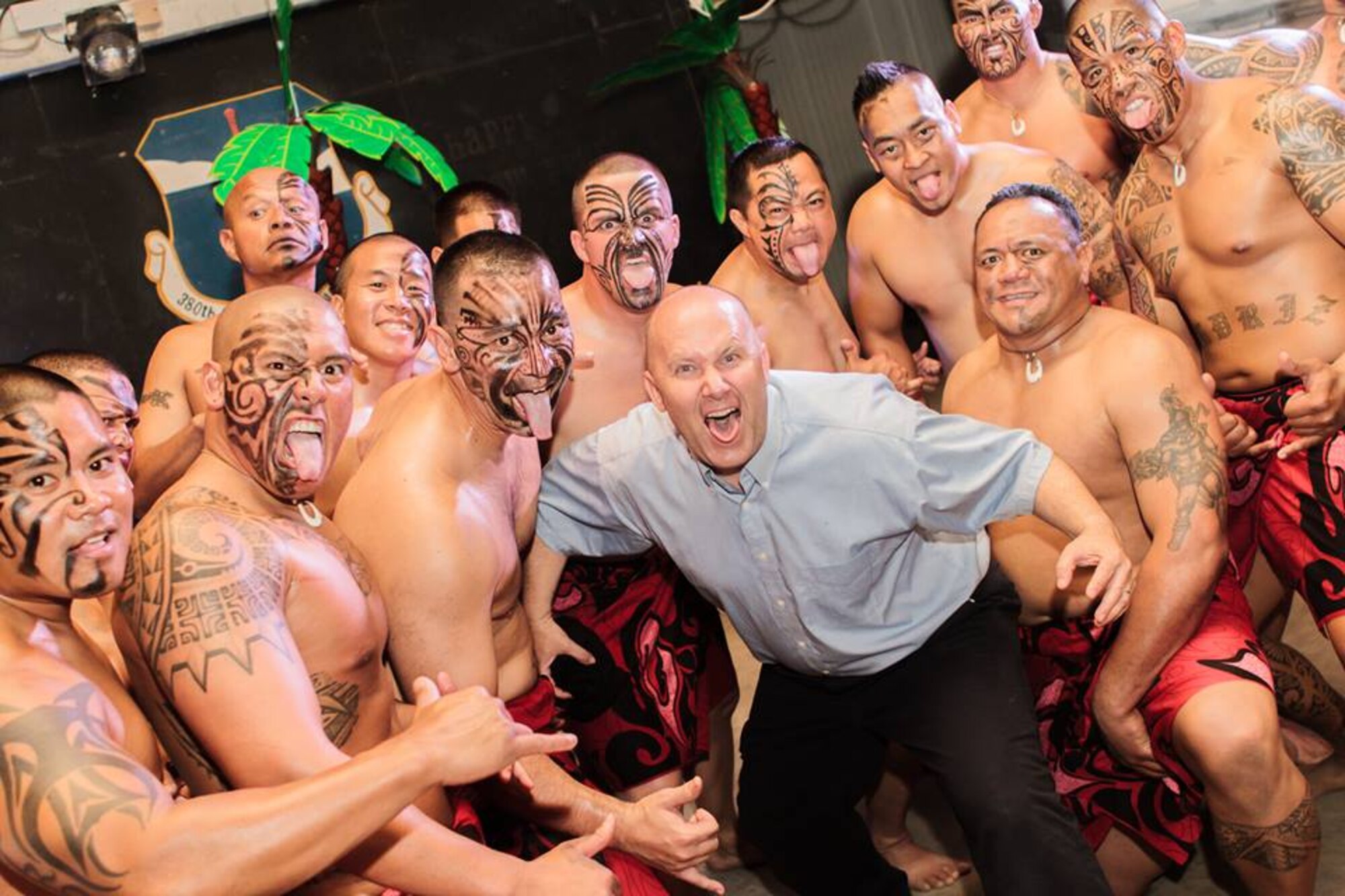 U.S. Air Force Chaplain (Lt. Col.) Bruce Brewer, middle, 380th Air Expeditionary Wing chaplain, poses for a photo after performing a Haka dance at the Asian Pacific Islander heritage luau, at an undisclosed location in Southwest Asia, May 31, 2013. (U.S. Air Force photo by Tech. Sgt. Joshua J. Garcia)