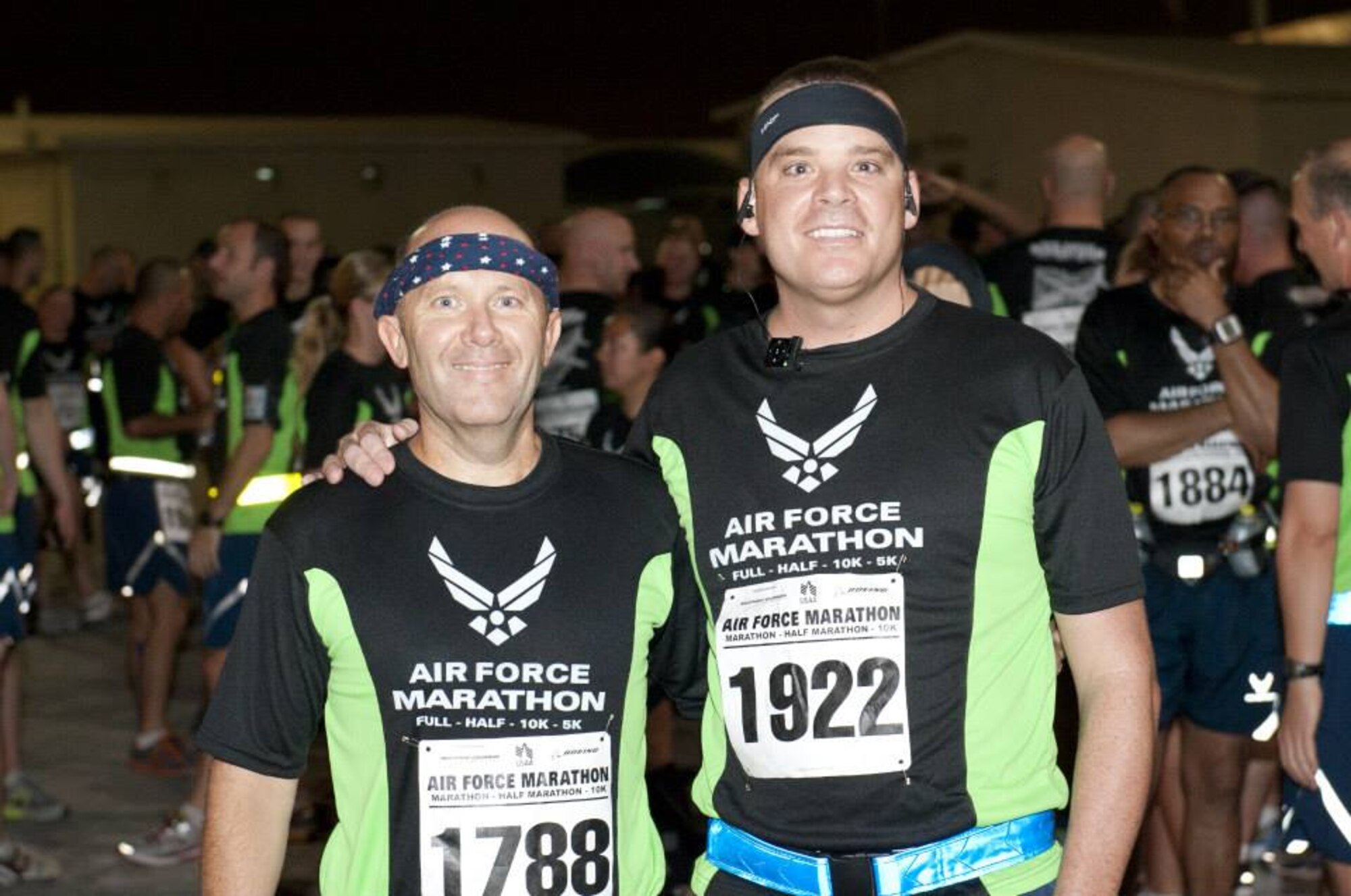 U.S. Air Force Chaplain (Lt. Col.) Bruce Brewer, left, 380th Air Expeditionary Wing chaplain, and U.S. Air Force Tech. Sgt. David Giberson, 380th AEW protocol, pose for a photo before the Air Force Marathon held at an undisclosed location in Southwest Asia. (U.S. Air Force photo by Staff Sgt. Jacob Morgan)