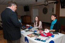 HANSCOM AIR FORCE BASE, Mass. -- Tom Fredericks, 66th Air Base Group deputy director, speaks to Sydney Dowd (left) and Kathleen Sullivan (right), Jimmy Fund development officers, during a Combined Federal Campaign Benefit Fair at the Minuteman Commons, Nov. 1. Several organizations were invited on base in order to provide employees opportunities to learn more about CFC and ways to give to a local charity. (U.S. Air Force photo by Mark Herlihy)