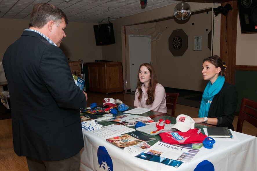 HANSCOM AIR FORCE BASE, Mass. -- Tom Fredericks, 66th Air Base Group deputy director, speaks to Sydney Dowd (left) and Kathleen Sullivan (right), Jimmy Fund development officers, during a Combined Federal Campaign Benefit Fair at the Minuteman Commons, Nov. 1. Several organizations were invited on base in order to provide employees opportunities to learn more about CFC and ways to give to a local charity. (U.S. Air Force photo by Mark Herlihy)