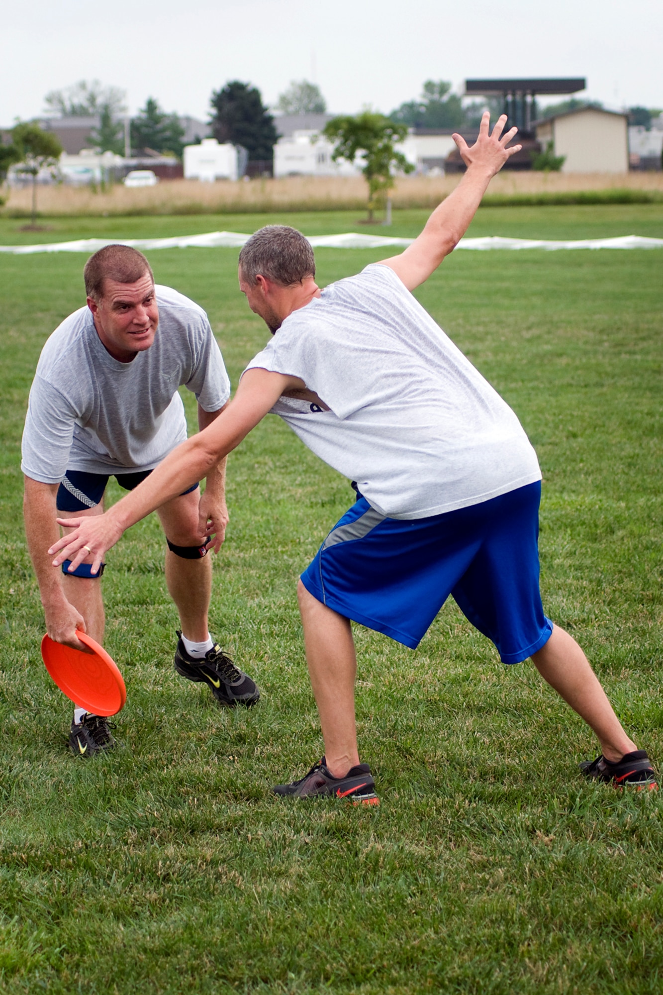 Mark Copp is guarded by Cory Walters during a game of ultimate at Grissom Air Reserve Base, Ind., Aug. 8, 2013. Copp is a 434th Operations Support Squadron combat crew communications superintendent and Walters is a 434th Civil Engineer Squadron biological scientist. (U.S. Air Force photo/Tech. Sgt. Mark R. W. Orders-Woempner)