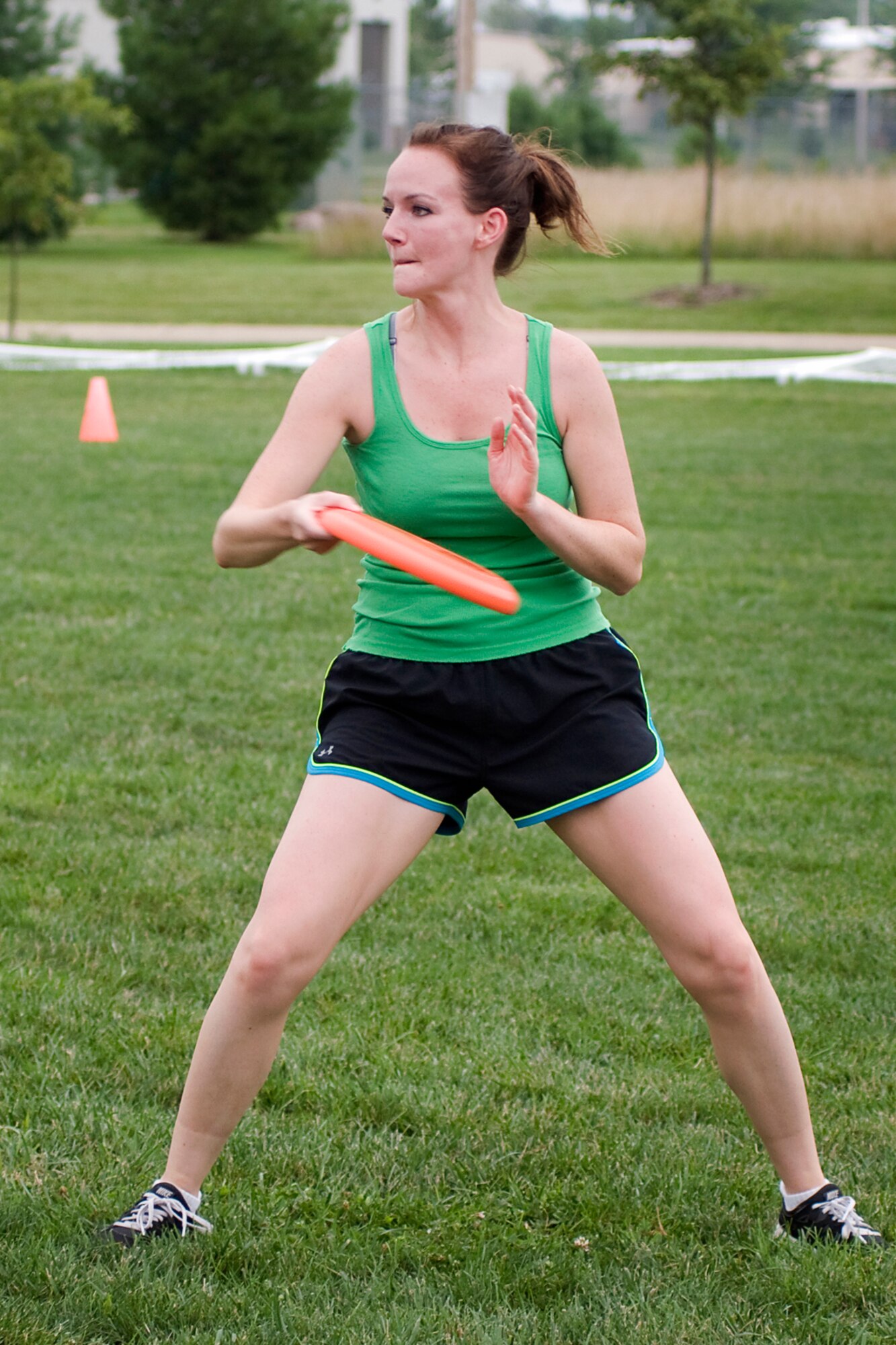 Michaela McClintock throws a disc during a game of ultimate at Grissom Air Reserve Base, Ind., Aug. 8, 2013. McClintock and other Grissom personnel gather together each Tuesday and Thursday in the summer to play a game on their lunch hour. (U.S. Air Force photo/Tech. Sgt. Mark R. W. Orders-Woempner)
