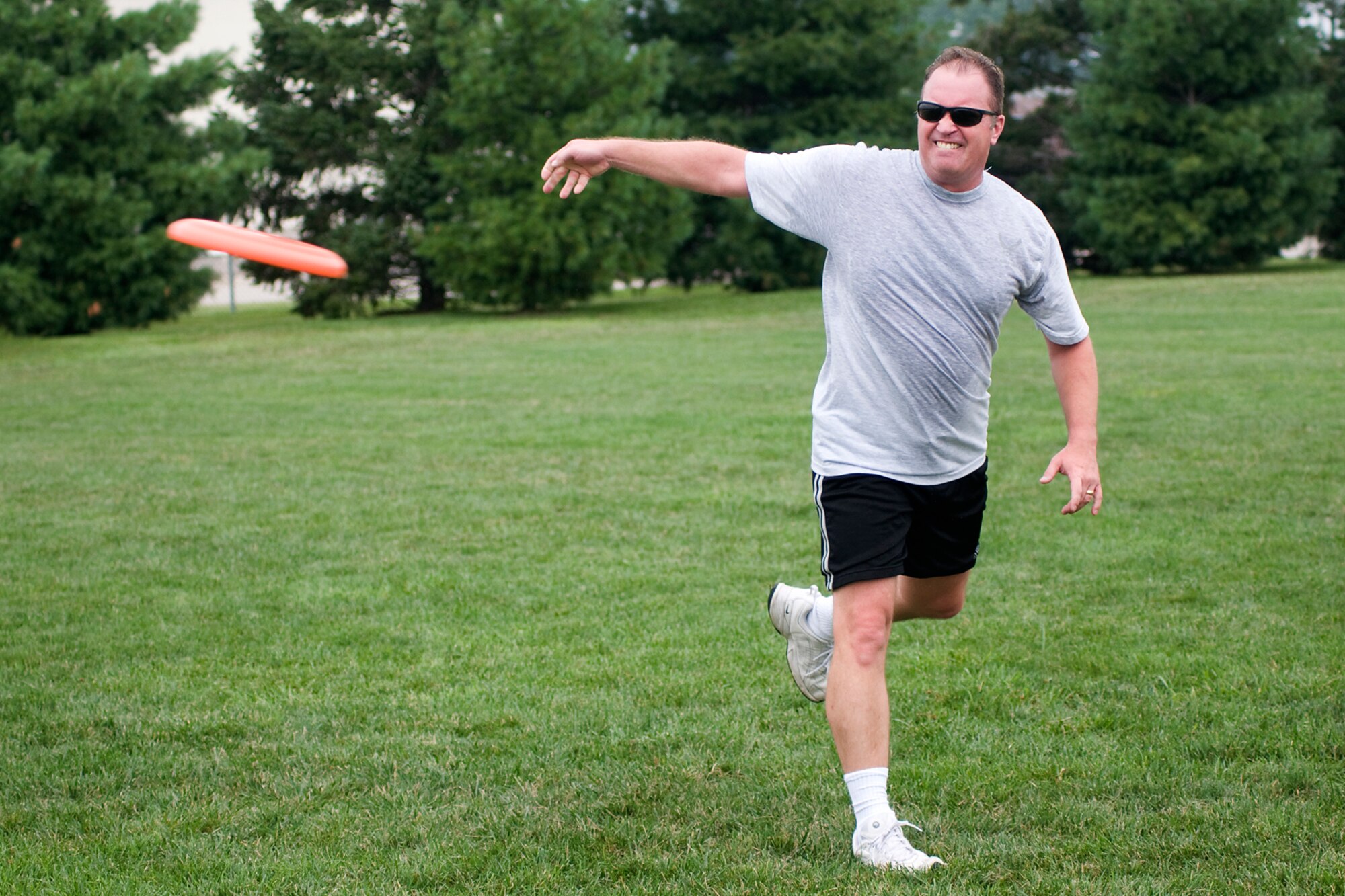 Joe Austin Jr. flings a disc during a game of ultimate at Grissom Air Reserve Base, Ind., Aug. 8. 2013. Austin is the 434th OSS chief of current operations. (U.S. Air Force photo/Tech. Sgt. Mark R. W. Orders-Woempner)