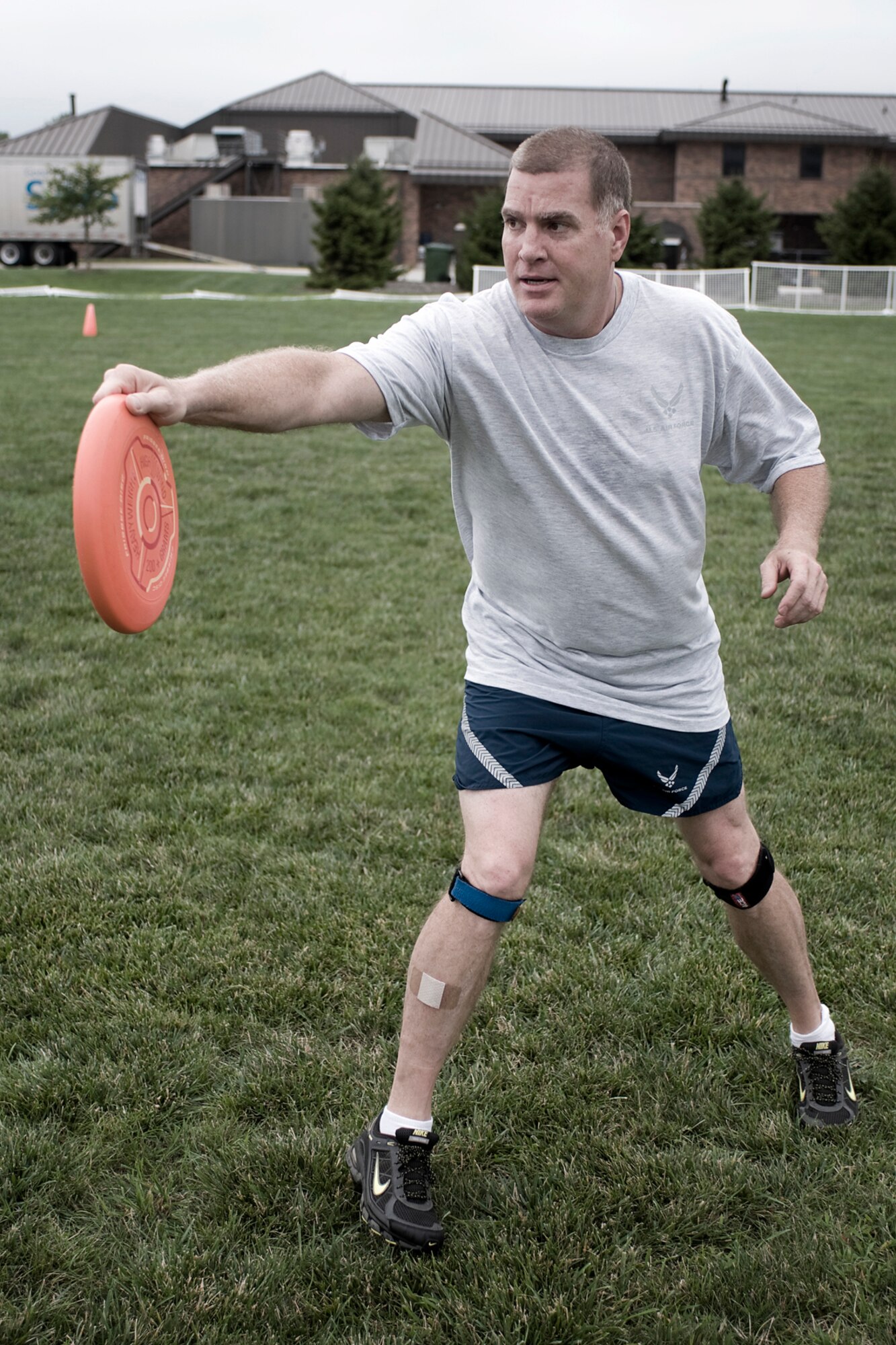 Mark Copp prepares to fling a disc during a game of ultimate at Grissom Air Reserve Base, Ind., Aug. 8. 2013. Copp is a 434th Operations Support Squadron combat crew communications superintendent. (U.S. Air Force photo/Tech. Sgt. Mark R. W. Orders-Woempner)