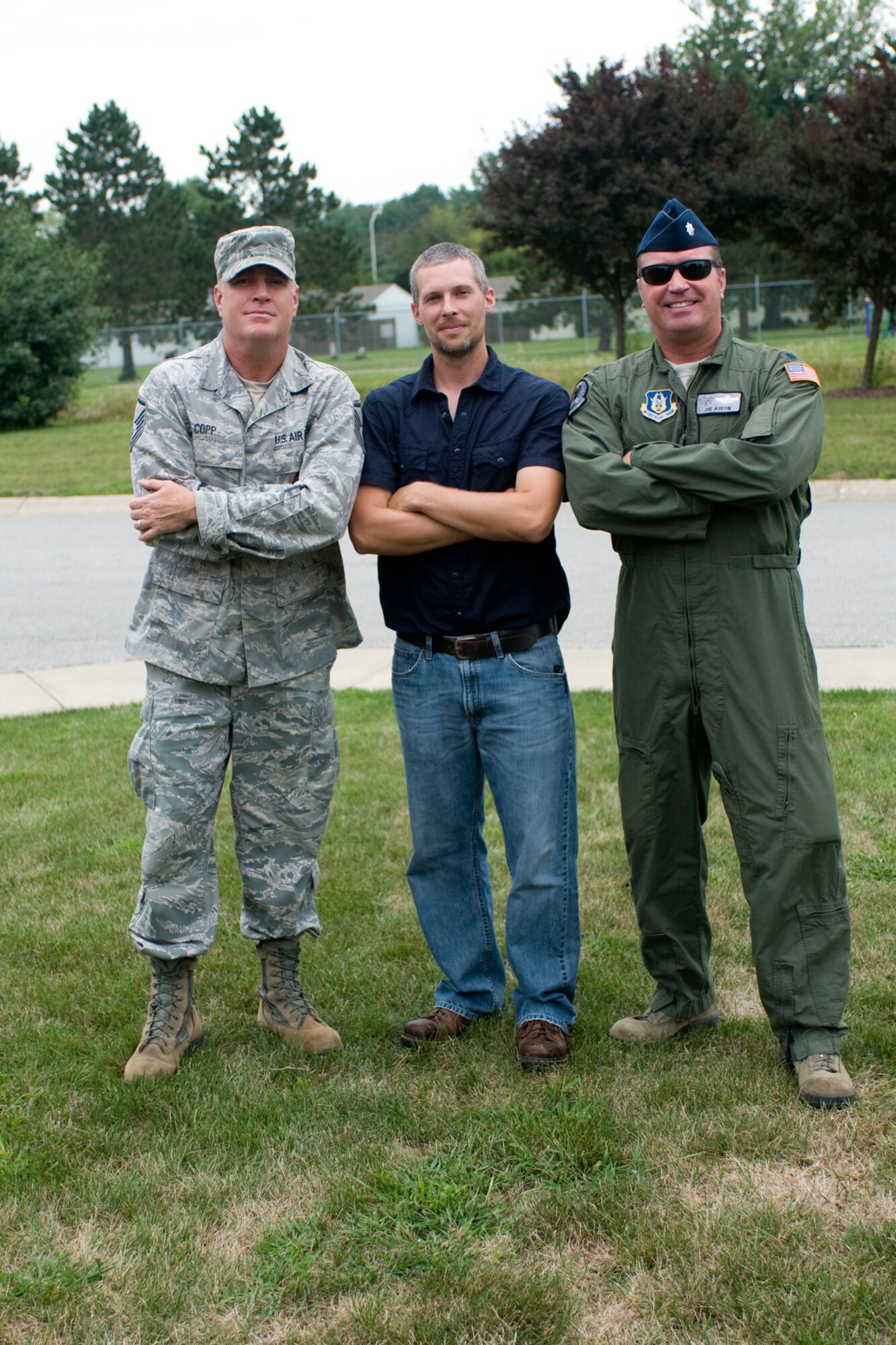 From left to right, Master Sgt. Mark Copp, Cory Walters and Lt. Col. Joe Austin Jr. pose for a photo prior to playing in a game of ultimate at Grissom Air Reserve Base, Ind., Aug. 8. 2013. Copp is a 434th Operations Support Squadron combat crew communications superintendent, Walters is a 434th Civil Engineer Squadron biological scientist and Austin is a 434th OSS chief of current operations. (U.S. Air Force photo/Tech. Sgt. Mark R. W. Orders-Woempner)