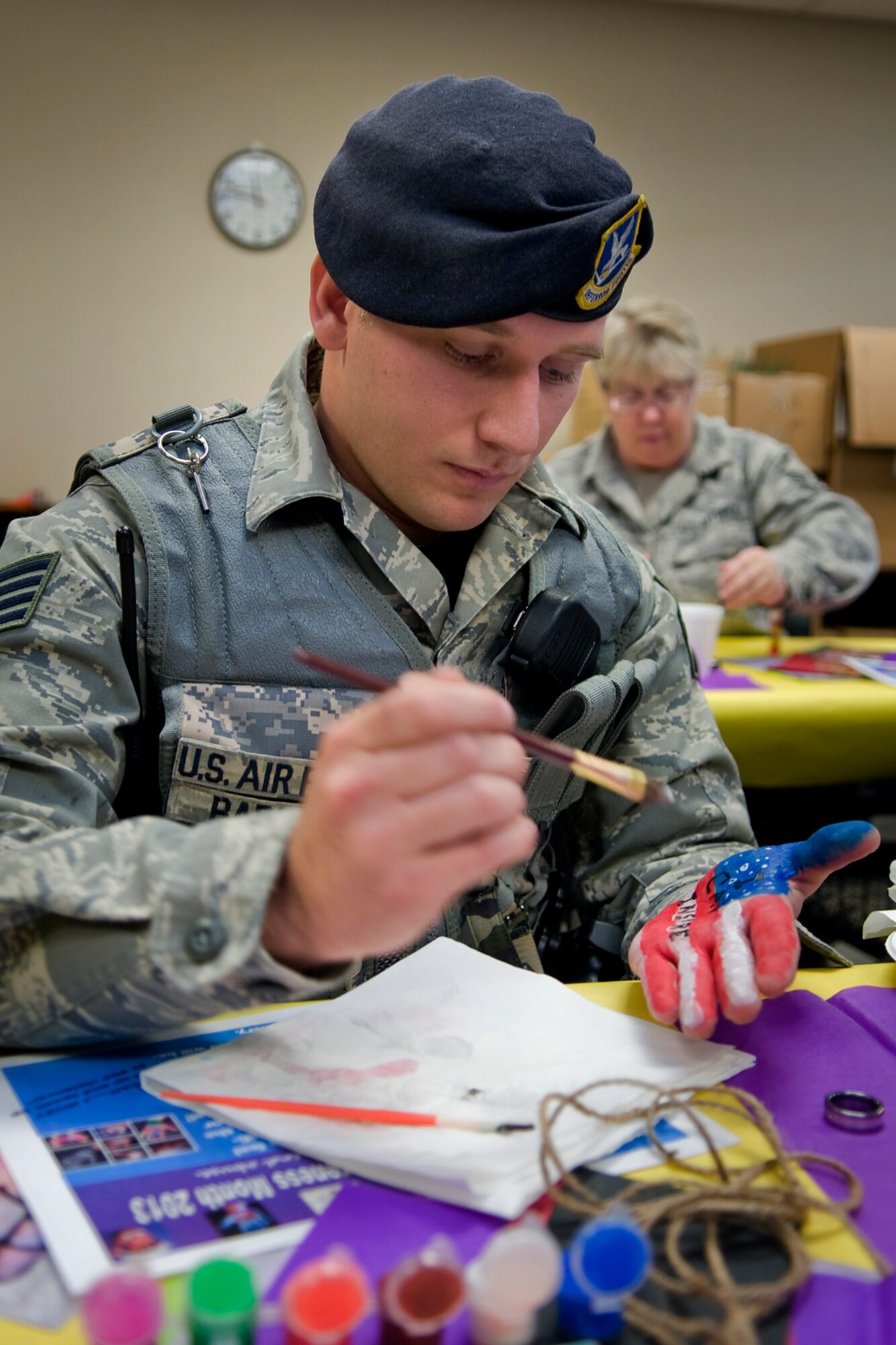 Staff Sgt. Richard D. Barrett IV, foreground, and Master Sgt. Rebecca Mattox paint their hands with I Can statements at Grissom Air Reserve Base, Ind., Oct. 17, 2013. Barrett is a 434th Security Forces Squadron security response team member, and Mattox is a 434th Aerospace Medicine Squadron health services manager. (U.S. Air Force photo/Tech. Sgt. Mark R. W. Orders-Woempner)

