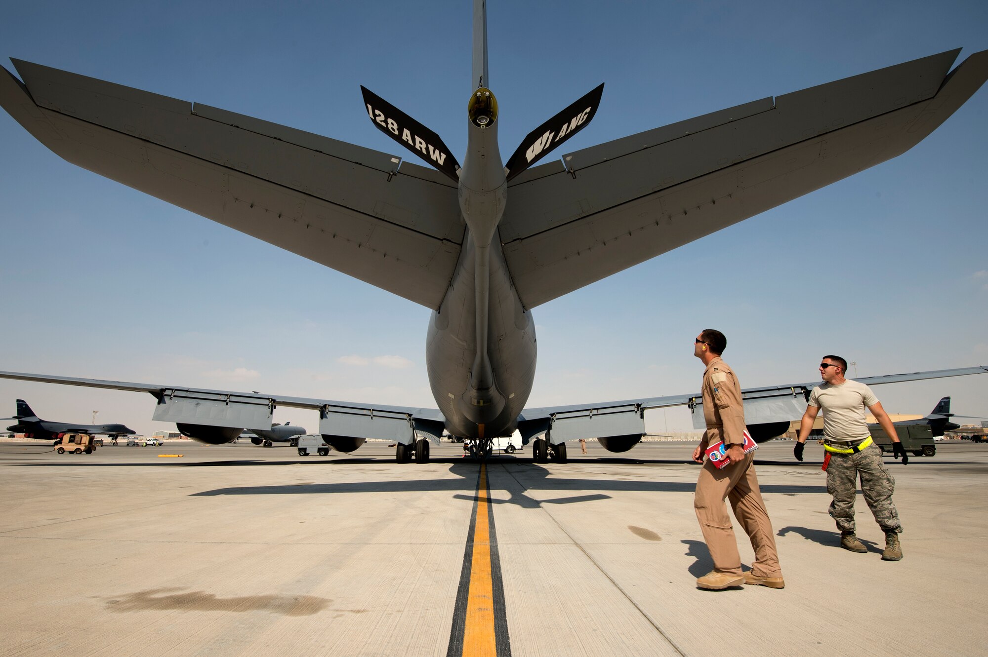 Capt. Derrick Baker, 340th Expeditionary Air Refueling Squadron pilot, accompanied by Senior Airman Devon Neil, 340th Aircraft Maintenance Unit avionics technician, preflights a KC-135R Stratotanker in preparation for a refueling mission over southern Afghanistan, Nov. 6, 2013. Baker, a Brandon, Fla., native, is deployed from Seymour Johnson Air Force Base, N.C. Neil, an Orange, Texas, native, is deployed from Scott Air Force Base, Ill. (U.S. Air Force Photo/Master Sgt. Ben Bloker)