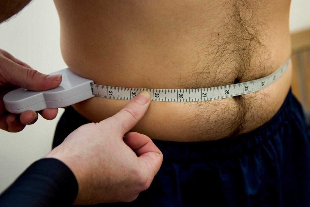 A 434th Security Forces Airman has his waist measured at Grissom Air Reserve Base, Ind., Oct. 31, 2013. Under a new Air Force Instruction, abdominal circumference assessments have changed so that those who measure above the maximum allowable waist and who have passed all three other components with no exemptions will have two additional and different measurements taken of their body fat to determine if they meet standards. (U.S. Air Force photo/Tech. Sgt. Mark R. W. Orders-Woempner) 
