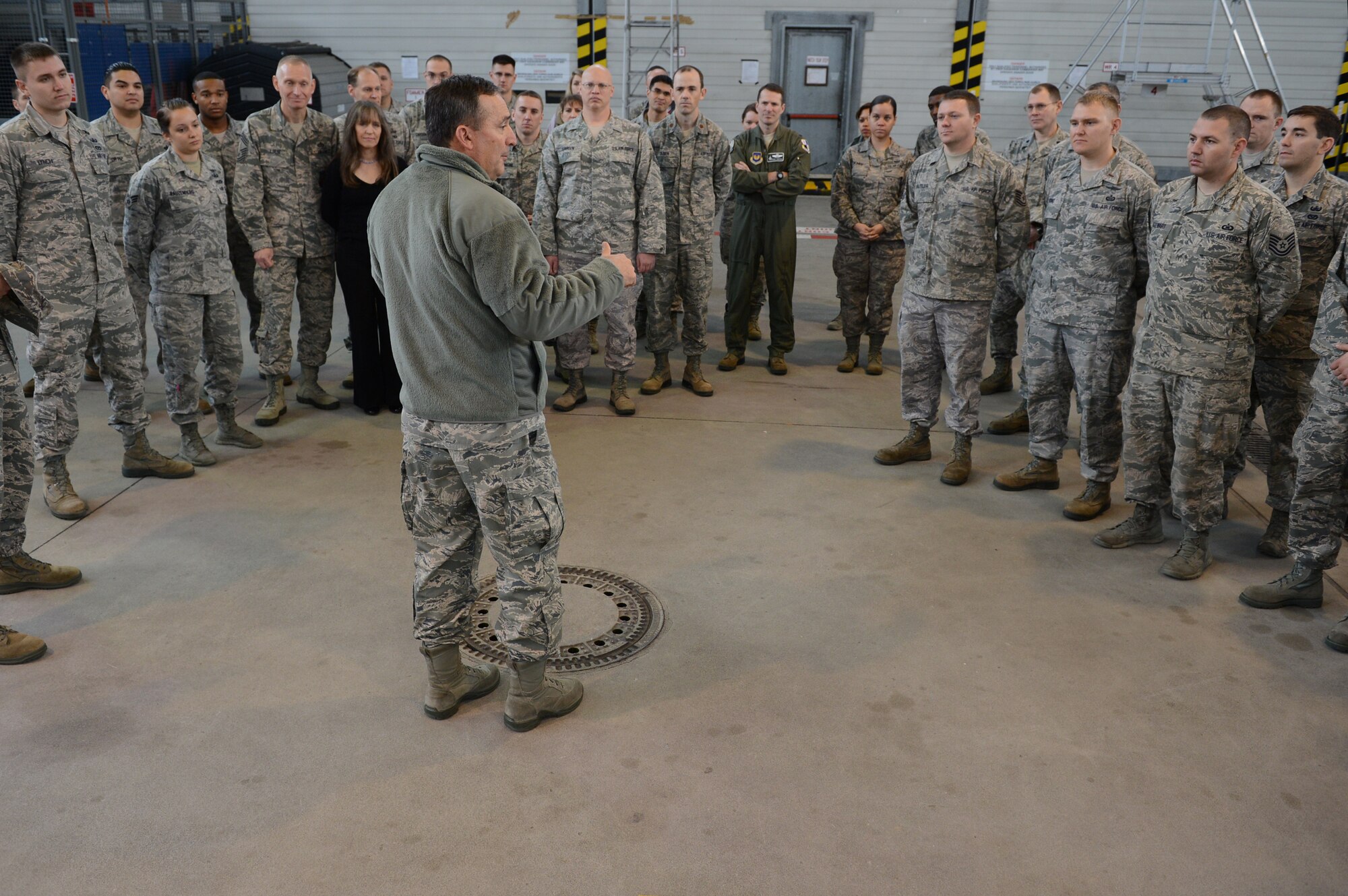SPANGDAHLEM AIR BASE, Germany – Lt. Gen. Stephen Mueller, U.S. Air Force inspector general, answers questions from Airmen and gathers feedback about the inspection system Nov. 5, 2013. Mueller coined several Airmen for their outstanding performance during the unit effectiveness inspection in September 2011. The UEI encourages Airmen to do their job correctly and bring forth any problems. (U.S. Air Force photo by Airman 1st Class Kyle Gese/Released) 
