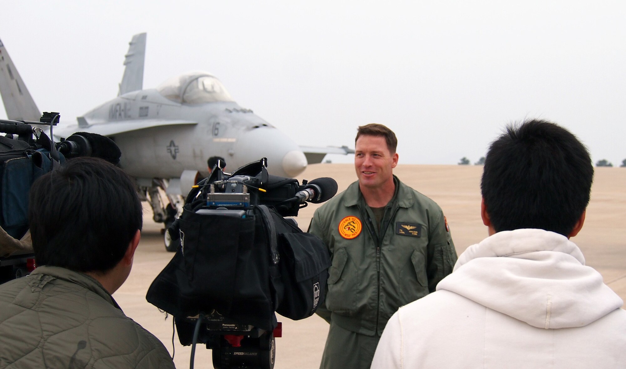 KUNSAN AIR BASE, Republic of Korea – Marine F/A-18C pilot Lt. Col. Patrick Houlahan is interviewed by Republic of Korea reporters during the Exercise Max Thunder media day Nov. 6, 2013. The U.S. Marine Corps is participating in Max Thunder for the first time this year, sending F/A-18s and EA-6Bs to fly in an invaluable training opportunity which  increases confidence, capabilities and cohesion between the U.S. and the ROK. More than 20 local, national and international reporters and photographers came to Kunsan AB to see the exercise, which fosters bilateral aerial training between the Korea Air Power Team including the U.S. Air Force, Army and Marine Corps and the Republic of Korea Air Force. (U.S. Air Force photo by Tech. Sgt. Thomas J. Doscher)