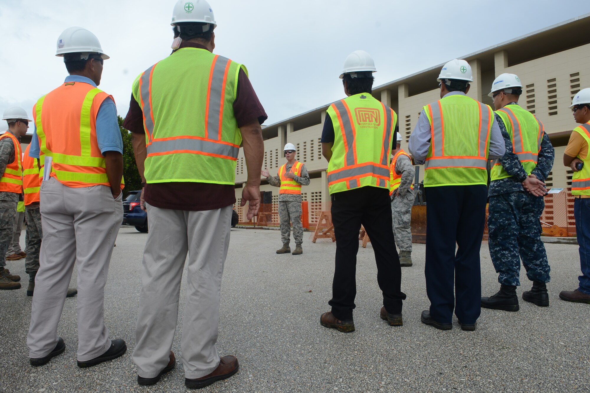 Brig. Gen. Steven Garland, 36th Wing commander, addresses workers who are preparing to demolish Bldg. 21000 Nov. 5, 2013, on Andersen Air Force Base, Guam. The building is being demolished to make use of square footage in other buildings and save energy for the Air Force. (U.S. Air Force photo by Airman 1st Class Emily A. Bradley/Released)