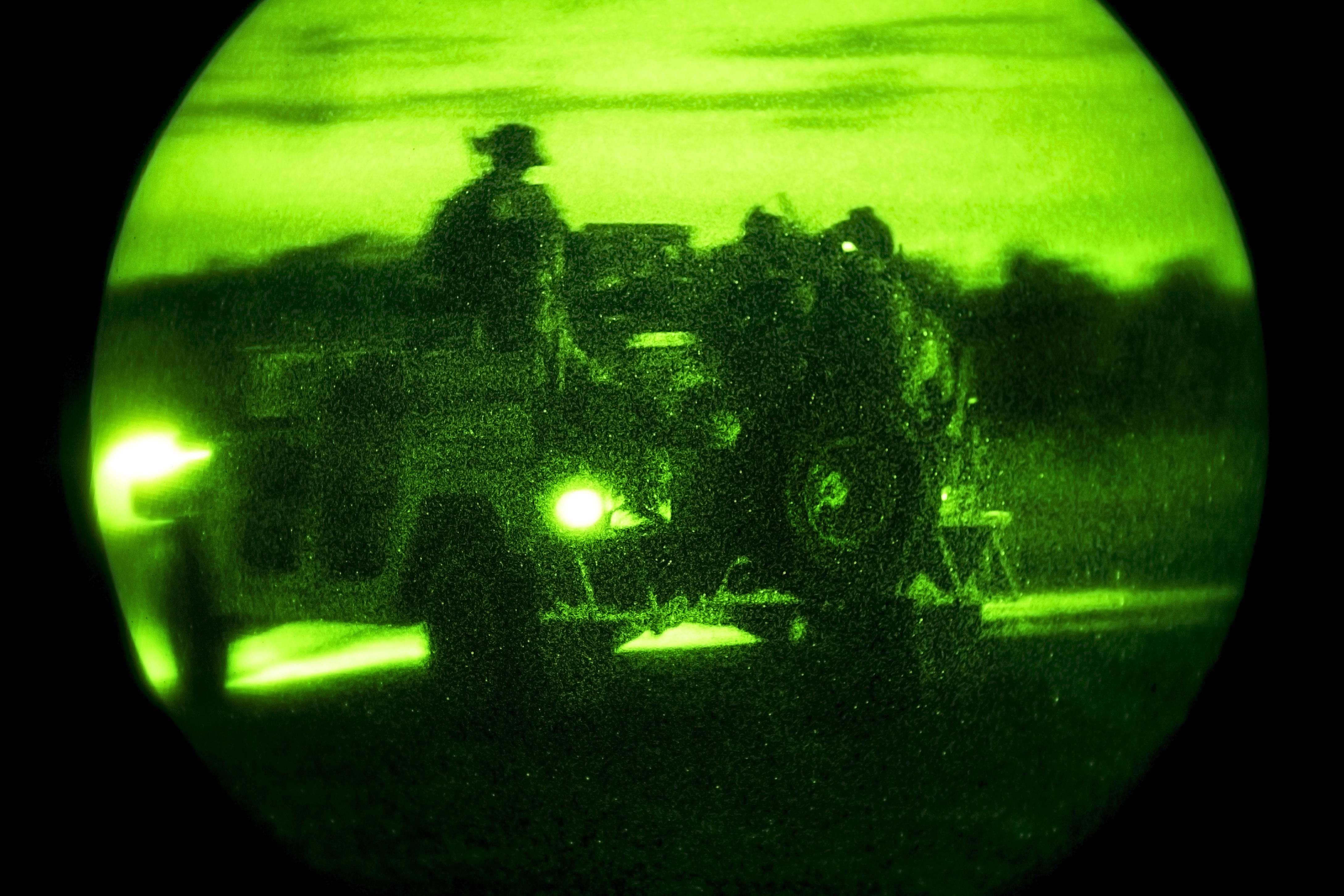 As seen through a nightvision device, Army Special Forces members