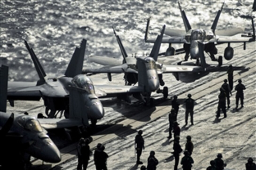 U.S. Navy sailors prepare aircraft to launch from the aircraft carrier USS Nimitz in the Mediterranean Sea, Nov. 5, 2013. The Nimitz is deployed to support maritime security operations and theater security cooperation efforts in the U.S. 6th Fleet area of responsibility. 