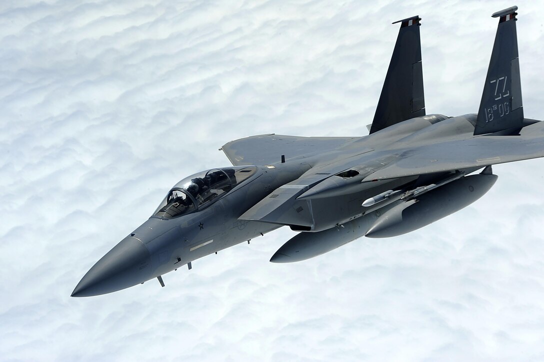 An F-15 Eagle from the 67th Fighter Squadron breaks away from a 909th Air Refueling Squadron KC-135 Stratotanker over the Pacific Ocean Oct. 28, 2013. For more than three weeks, six F-15s from the 67th FS trained with the Singapore air force to improve international cohesion and further develop allied partnerships for the security of the Asia-Pacific region. (U.S. Air Force photo/Senior Airman Maeson L. Elleman)