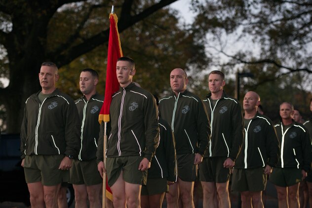 Marines from Joint Base Myer-Henderson Hall and the Pentagon stand in formation after running to the Marine Corps Memorial in Arlington, Va. Nov. 8, 2013, in commemoration of the Corps' upcoming 238th birthday Nov. 10.  The Sgt. Maj. of the Marine Corps Micheal P. Barrett applauded the Marines for being part of an all-volunteer force before leading the singing of the Marines' Hymn. (U.S. Marine photo by Cpl. Malissa Karnath/Released)