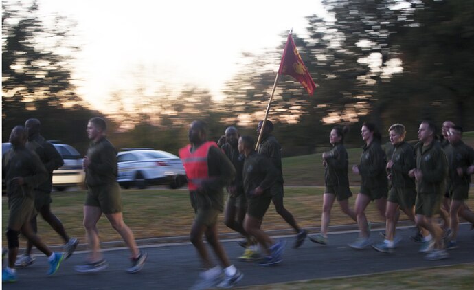 Marines from Joint Base Myer-Henderson Hall and the Pentagon participate in a motivational run led by Sgt. Maj. of the Marine Corps Micheal P. Barrett Nov. 8, 2013, in commemoration of the Corps' upcoming 238th birthday Nov. 10. The Marines ran approximately a mile and a half from the Pentagon and ended the run with a ceremony at the Marine Corps War Memorial in Arlington, Va. Barrett applauded the Marines for being part of an all-volunteer force before leading the singing of the Marines' Hymn. (U.S. Marine Corps photo by Lance Cpl. Dylan Bowyer/Released)