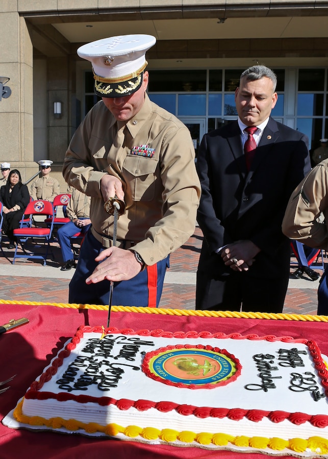 NEW ORLEANS - Mr. Gregg Habel, Executive Director of Marine Forces Reserve and Marine Forces North, watches Lt. Col. Brian J. Hardy, Commanding Officer of Headquarters Battalion, MARFORRES, cut the Marine Corps Birthday cake, during a cake cutting ceremony aboard the Marine forces Reserve Support Facility, New Orleans, La., Nov. 8. More than 500 Marines assigned to HQBN, MARFORRES participated in the annual cake cutting ceremony. The cake cutting ceremony is a long-standing tradition in celebrating the birth date of the United States Marine Corps. (U.S. Marine Corps photo by Cpl. Lauren Whitney/Released)


