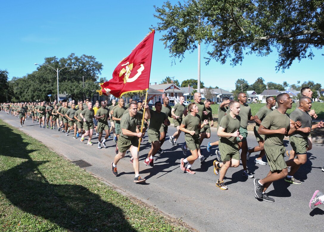 NEW ORLEANS - Marines with Headquarters Battalion, Marine Forces Reserve, run the streets of the Algiers community during a motivational run in New Orleans Nov. 8, 2013. More than 500 Marines assigned to HQBN, MARFORRES participate in an annual motivational run in celebration of the United States Marine Corps Birthday. Nov. 10, 2013 will mark the Marine Corps' 238th anniversary of its founding in 1775. (U.S. Marine Corps photo by Cpl. Lauren Whitney/Released)



