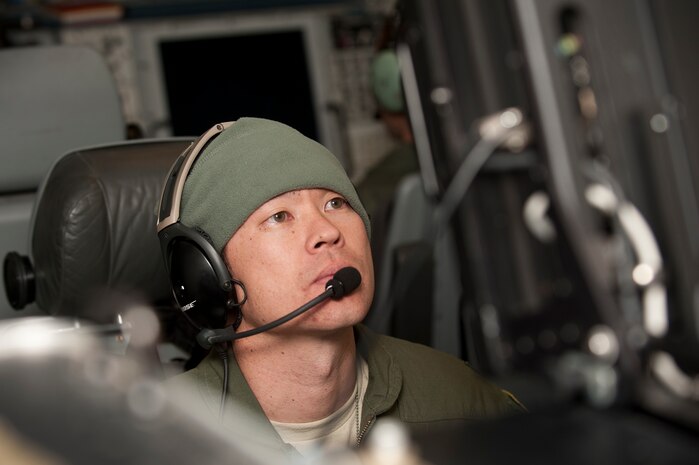 Capt. Billy Pollard, 960th Airborne Air Control Squadron air surveillance officer, participates in a Green Flag-West exercise on an E-3 Sentry airborne early warning and control aircraft Nov.5, 2013, in support of ground training at Fort Irwin, Calif. The E-3 Sentry AWACS provides an accurate, real-time picture of a battle space to the Joint Air Operations Center. Green Flag-West is a Close Air Support and Joint exercise administered by the U.S. Air Warfare Center and Nellis AFB through the 549th Combat Training Squadron. (U.S. Air Force photo by Staff Sgt. Christopher Hubenthal)