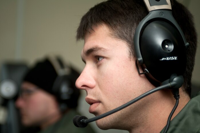 Senior Airman Kyle Ware, 960th Airborne Air Control Squadron airborne surveillance technician, tracks exercise information during Green Flag-West on an E-3 Sentry airborne early warning and control aircraft Nov. 5, 2013, in support of ground training at Fort Irwin,Calif. The E-3 Sentry AWACS acts as an integrated command and control battle management, surveillance, target detection and tracking platform. Green Flag-West is a Close Air Support and Joint exercise administered by the U.S. Air Warfare Center and Nellis AFB through the 549th Combat Training Squadron. (U.S. Air Force photo by Staff Sgt. Christopher Hubenthal)