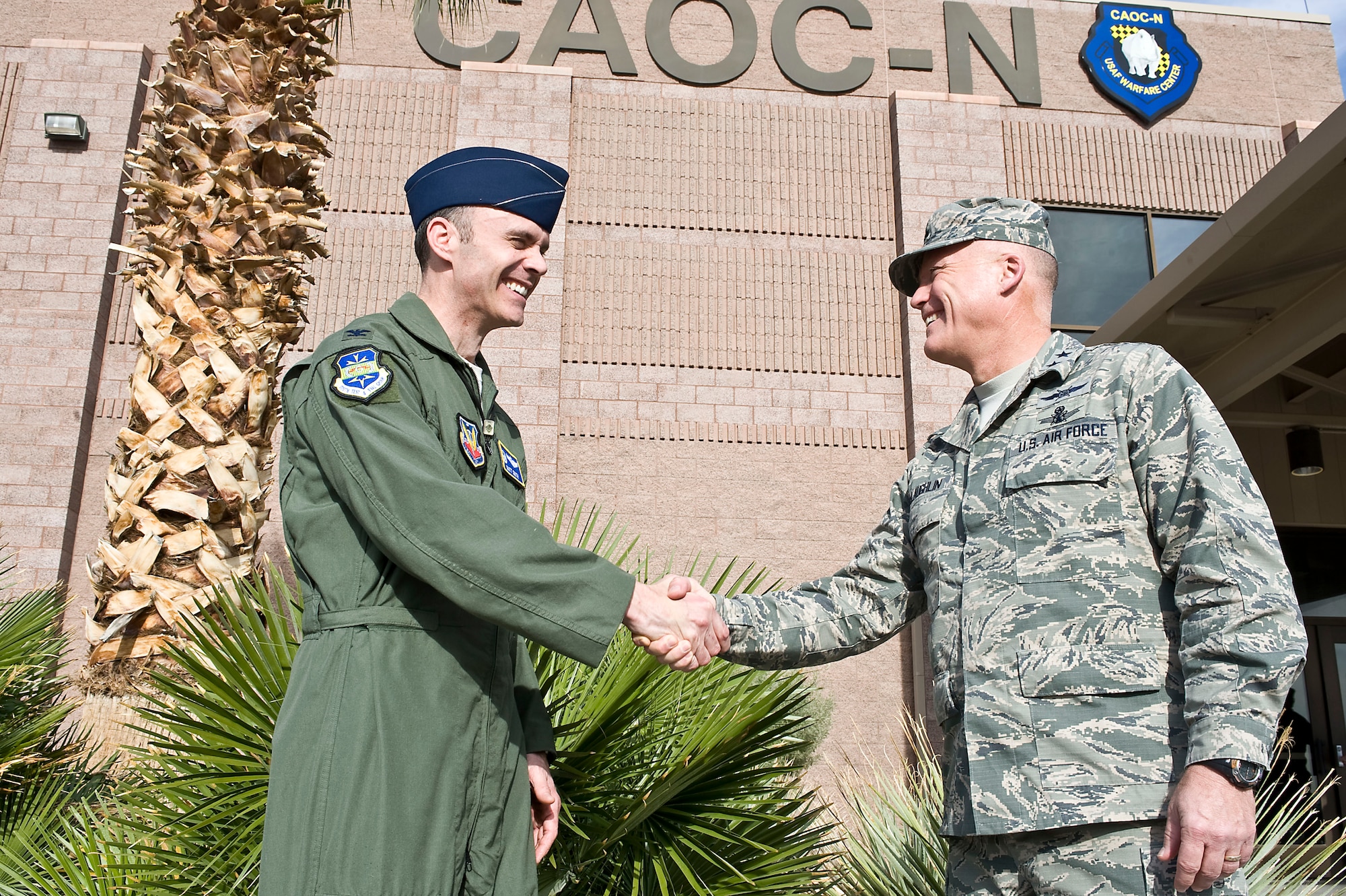 131107-F-HG907-016
Col. Matthew Smith (left), 505th Test and Evaluation Group commander,
greets Maj. Gen. Kevin McLaughlin, 24th Air Force commander, outside the
Combined Air Operations Center during Cyber Flag 14-1, Nov. 7, 2013, at
Nellis Air Force Base, Nev. Cyber Flag is a tactical training exercise for
cyber teams across the services as well as coalition partners in support of
national and theater objectives. (U.S. Air Force photo by Senior Airman
Matthew Lancaster)
