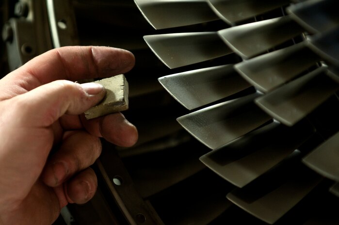 Robert Marshall, 57th Maintenance Group Propulsion Shop, contractor aerospace propulsion mechanic, inspects an F100-229 engine for damage Nov. 7, 2013, at Nellis Air Force Base, Nev. The 57th MXG maintains, disassembles, assembles, inspects, repairs and tests 185 aircraft engine propulsion units. (U.S. Air Force photo by Staff Sgt. Christopher Hubenthal)