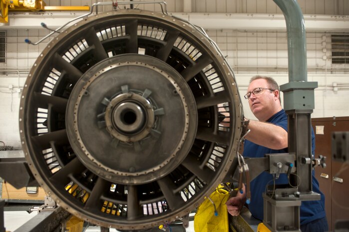 Robert Marshall, 57th Maintenance Group Propulsion Shop, contractor aerospace propulsion mechanic, inspects an F100-229 engine for damage Nov. 7, 2013, at Nellis Air Force Base, Nev. The 57th MXG maintains, disassembles, assembles, inspects, repairs and tests 185 aircraft engine units. (U.S. Air Force photo by Staff Sgt. Christopher Hubenthal)
