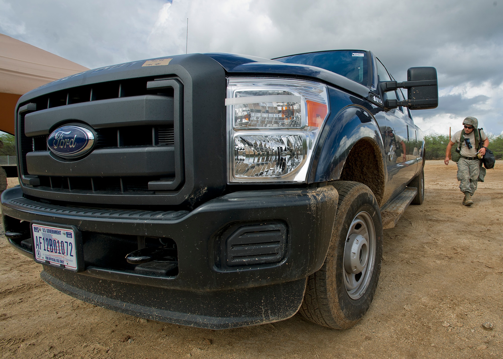 Senior Airman Chu Hyurn, 154th Force Support Squadron fitness specialist, performs simulated a post attack reconnaissance sweep around their assets and structures during an Operational Readiness Inspection at Joint Base Pearl Harbor-Hickam, Hawaii, Nov. 7. 2013. This inspection evaluated Airmen’s ability to respond to survive and operate during various wartime conditions. (U.S. Air Force photo/Tech. Sgt. Jerome S. Tayborn)