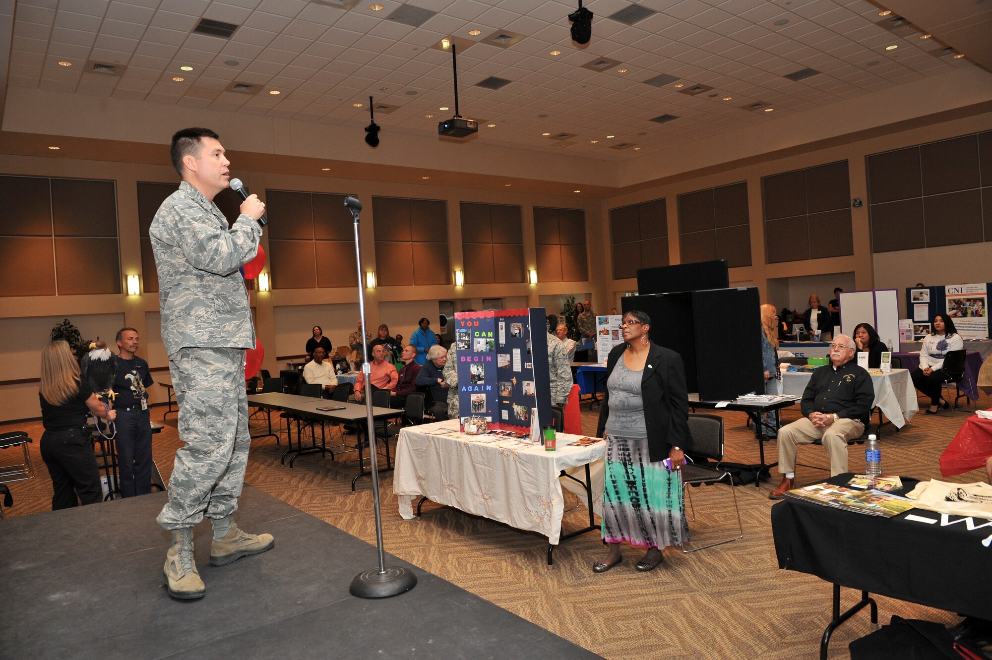 Col. Dan Wright, 460th Space Wing commander, addresses the attendees of the Team Buckley Combined Federal Campaign Kickoff event Nov. 7, 2013, at the Leadership Development Center on Buckley Air Force Base, Colo. The 2013 CFC kicked off with 55 charities being represented and donations by the wing commander and command chief. (U.S. Air Force photo by Senior Airman Phillip Houk/Released)