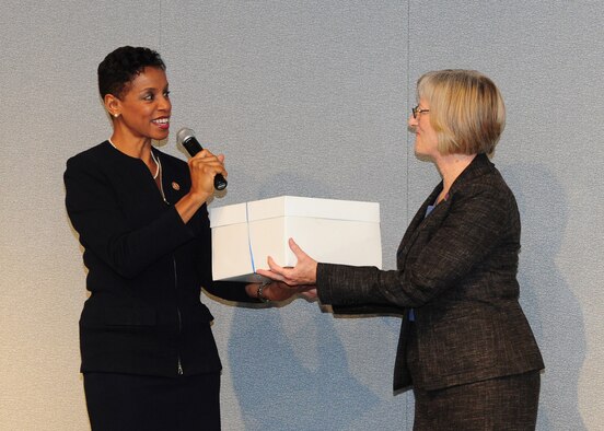 Dr. Elizabeth Peterson, right, accepts DVDs from Congresswoman Donna F. Edwards on behalf of The Library of Congress during the Veterans History Project Reception on Joint Base Andrews, Md., Nov. 8, 2013. More than 12,500 Veteran History Project collections have been digitized to date. Peterson is the director, American Folklife Center, Library of Congress and Edwards represents Maryland’s 4th Congressional District. (U.S. Air Force photo/Airman 1st Class Aaron Stout)