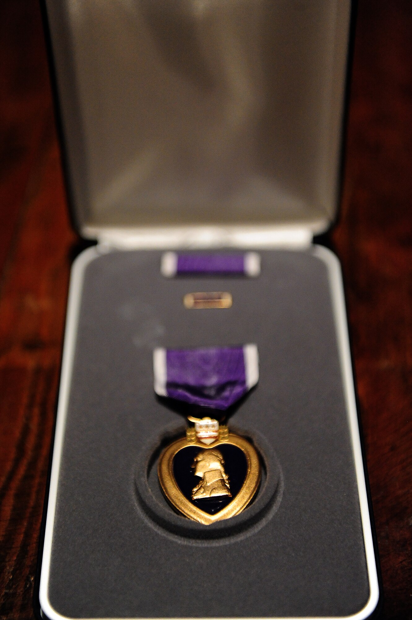 U.S. Air Force Senior Airman Justin Beasley, 4th Civil Engineer Squadron explosive ordnance disposal technician, received the Purple Heart medal during a ceremony at Seymour Johnson Air Force Base, N.C., Nov. 8, 2013.  During a recent deployment to Afghanistan, Beasley’s convoy ran over an improvised explosive device.  After escaping the ensuing firefight, he was diagnosed with a traumatic brain injury and still suffers from hearing loss.  (U.S. Air Force photo by Airman 1st Class Brittain Crolley)