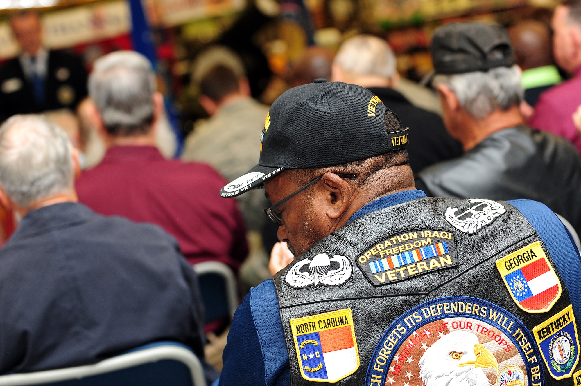 More than 50 people, including a dozen Vietnam veterans filled the commissary at Seymour Johnson Air Force Base, N.C., for a Vietnam War commemoration ceremony on Nov. 7, 2013. Service members past and present gathered to pay tribute to the Vietnam War, and witness the unveiling of the 50th Anniversary Vietnam War Commemoration flag. (U.S. Air Force photo by Airman 1st Class John Nieves Camacho)