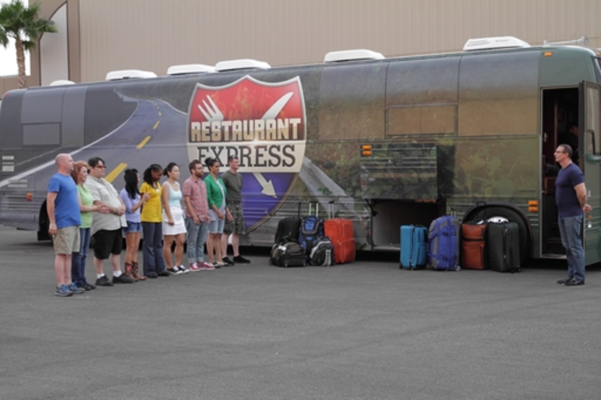 The group of nine contestants on the new Food Network television show, “Restaurant Express”, listen to the host, Robert Irvine, who is not only known for hosting “Restaurant Express” but also shows such as Restaurant: Impossible and Dinner: Impossible. (Courtesy Photo)