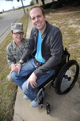 Staff Sgt. Ashley Jackson, an instructor, and Master Sgt. Albert “A.J.” Jackson, a career development course writer, are members of the 335th Training Squadron’s weather schoolhouse at Keesler Air Force Base, Miss.  A.J. is currently paralyzed from the waist down and confined to a wheelchair after multiple surgeries since his diagnosis with Marfan’s Syndrome.  Their squadron is hosting a “5K for A.J.” to raise funds to buy him a hand bicycle.  (U.S. Air Force photo by Kemberly Groue)