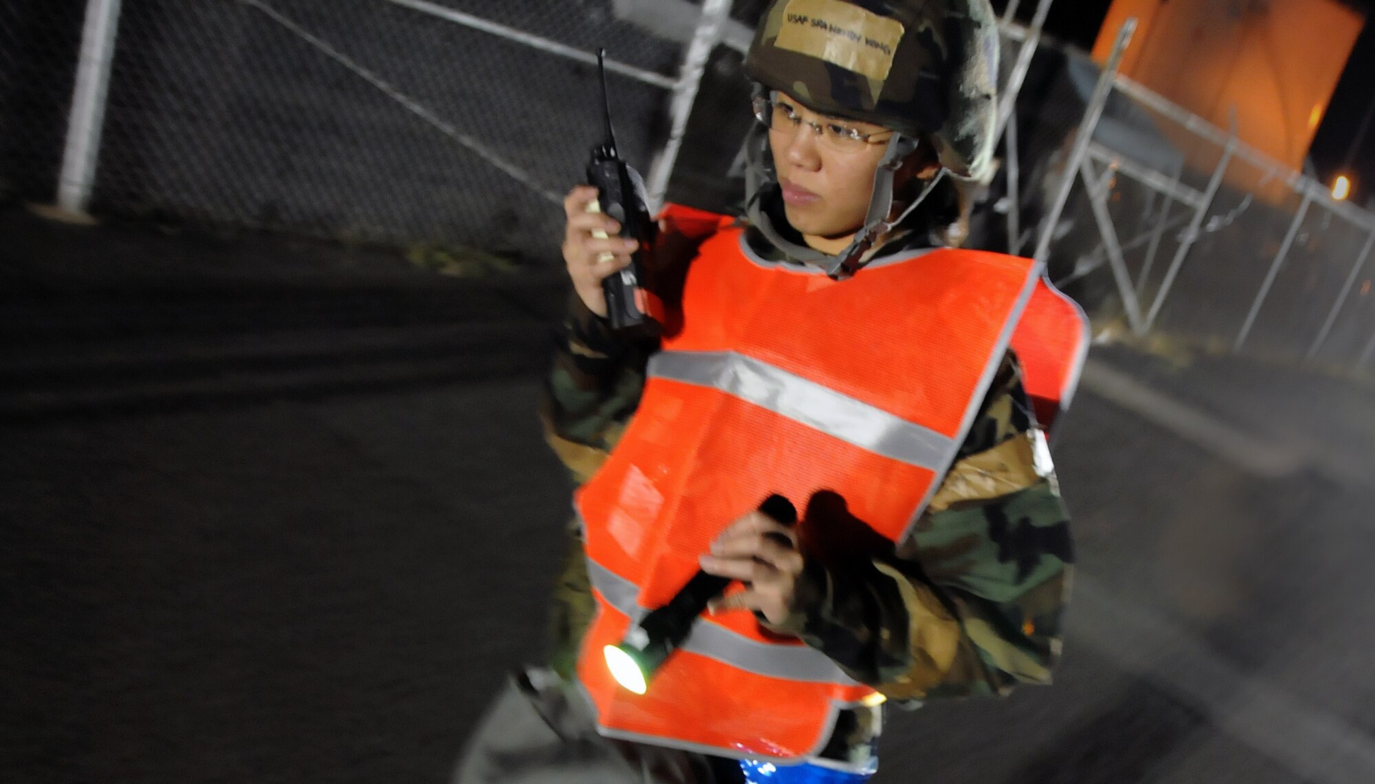 Senior Airman Wendy Kong, along with two members from 154th headquarters office, searches for UXO’s as part of a par sweep drill during an Operational Readiness Inspection at Joint Base Pearl Harbor-Hickam, Hawaii, Nov. 7. 2013. This inspection demonstrates the effective use of Total Force Integration by including both 15th Wing and 154th Hawaii Air National Guard Airmen working side-by-side to accomplish the mission. (U.S. Air Force photo/Tech. Sgt. Michelle Thomas)