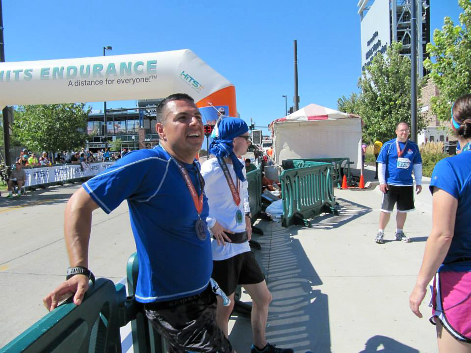 Tech. Sgt. Carlos Centeno, a 55 Intelligence Support Squadron marathon team member, rests after completing the Omaha Marathon on Sept. 22, 2013 in downtown Omaha. This marathon was one of two full marathons Centeno ran in consecutive days to qualify for ‘Insane Asylum’ status in the ‘Marathon Maniacs’ international running club. (Courtesy Photo)