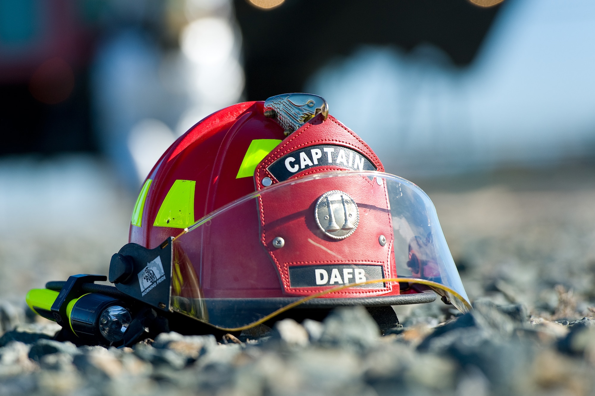 A 436th Civil Engineer Squadron Fire Department captain?s helmet sits on the ground Nov. 4, 2013, at the fire department training area on Dover Air Force Base, Del. A captain in the fire department is a noncommissioned officer holding the rank of staff sergeant or above. (U.S. Air Force photo/Roland Balik)