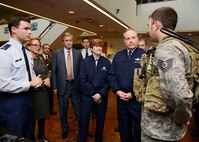 HANSCOM AFB, Mass. -- First Lt. Jareth Lamb (left) and Tech Sgt. Jeffrey Kennedy demonstrate Tactical Air Party Modernization equipment developed here to Air Force Chief of Staff Gen. Mark A. Welsh III, Gen. Janet Wolfenbarger, commander of Air Force Materiel Command, and U. S. Reps John Tierney and Niki Tsongas of Massachusetts Nov 8. (U.S. Air Force Photo By Walter Santos)