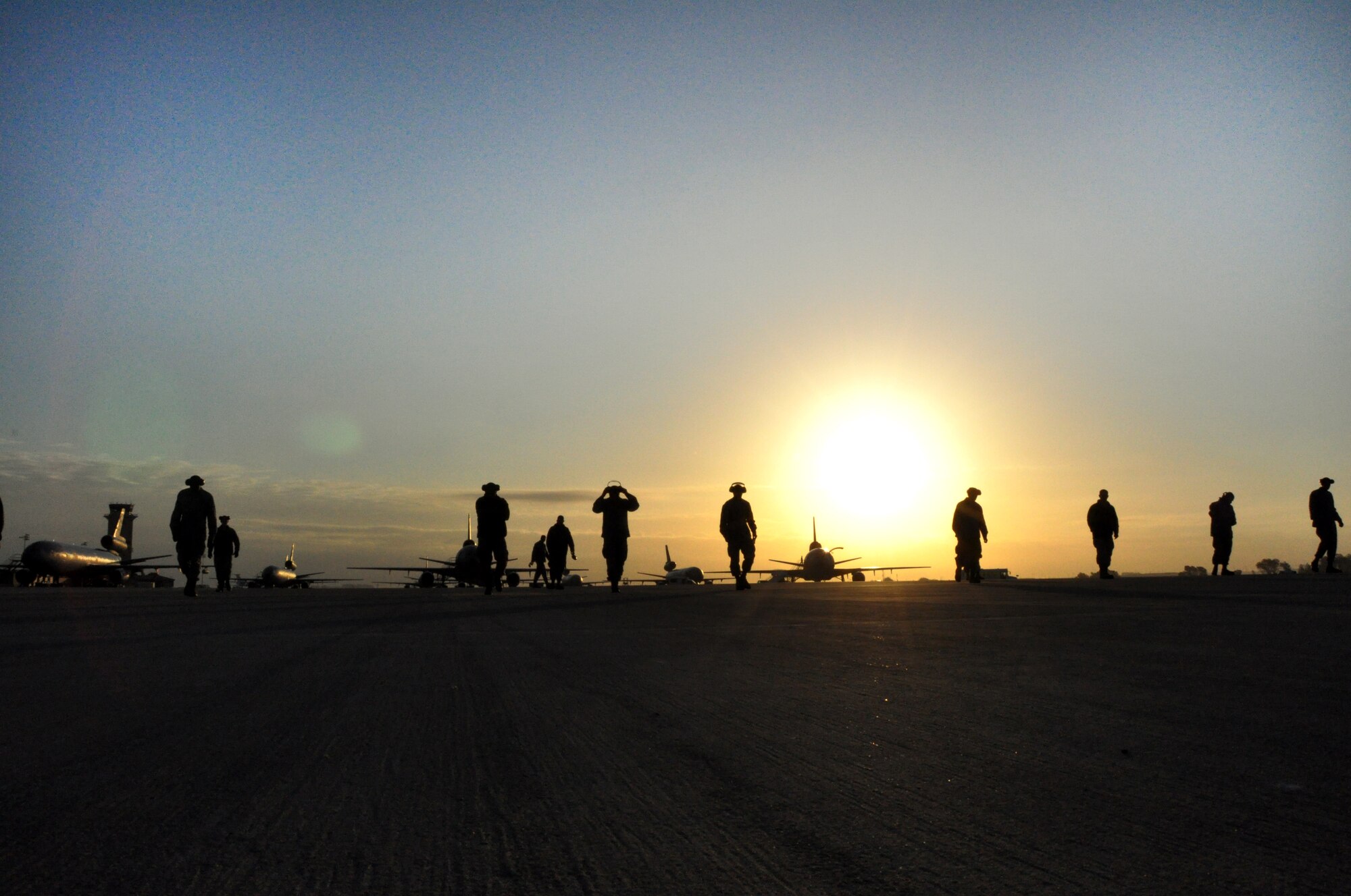 Airmen from the 60th Maintenance Squadron conduct a FOD walk Oct. 29 on the flightline.(U.S. Air Force photo/Staff Sgt. Patrick Harrower)