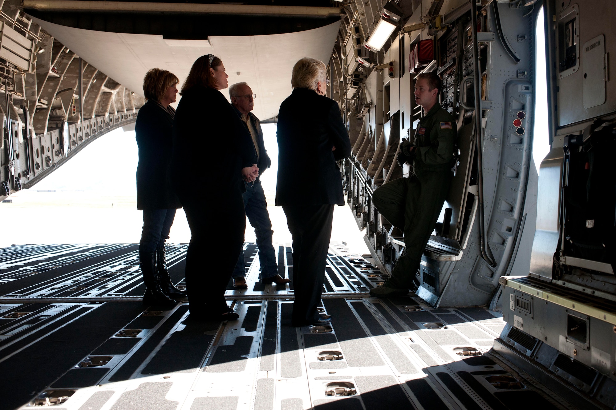 ALTUS AIR FORCE BASE, Okla. – U.S. Air Force Staff Sgt. Christopher Massey, 58th Airlift Squadron loadmaster, describes the capabilities of U.S. Air Force C-17 Globemaster III cargo aircraft to members of the Altus community during the Farm City Week tour Nov. 7, 2013. This year’s theme was “Farming, Flying & Community, the Pillars of Southwest Oklahoma.” While Airmen took to the farms, local farmers and community members were offered a firsthand look at the mission within Altus AFB. (U.S. Air Force photo by Senior Airman Jesse Lopez/Released)