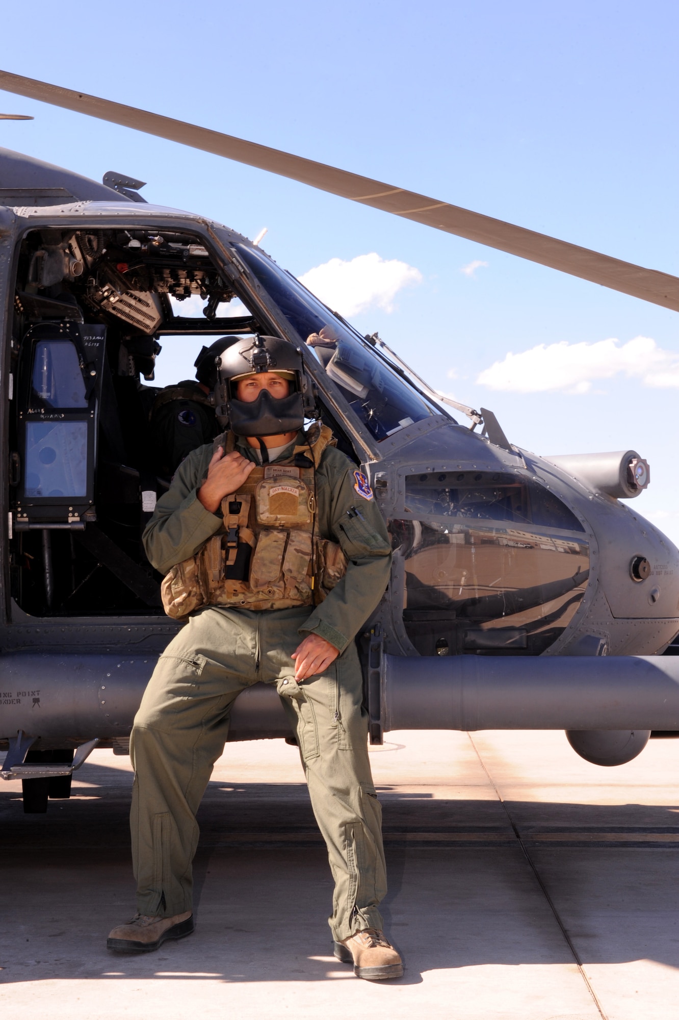 Capt. Brian R. Dicks, 55th Rescue Squadron pilot, sits on an HH-60G Pave Hawk helicopter before a flight at Davis-Monthan AFB, Ariz., Nov. 4, 2013.  Dicks was honored with the Air Rescue Association?s 2013 Richard T. Knight Award, which is presented annually to recognize an active duty or reserve component member who has contributed to the overall effectiveness of the rescue mission area through management, innovation or other outstanding achievement. (U.S. Air Force Photo by Airman 1st Class Chris Massey/Released)(cropped)