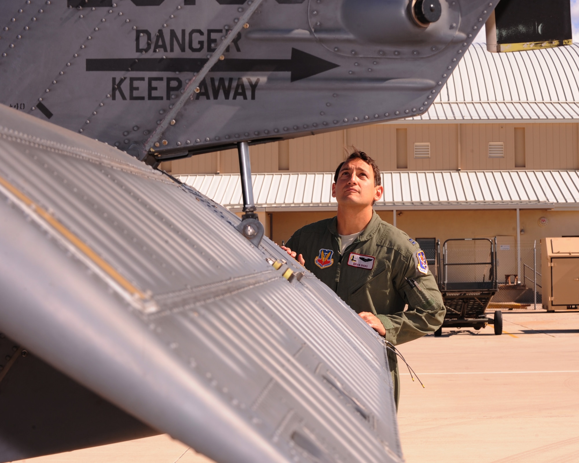 Capt. Brian R. Dicks, 55th Rescue Squadron pilot, performs a pre-flight inspection on an HH-60G Pave Hawk helicopter at Davis-Monthan AFB, Ariz., Nov. 4, 2013.  Dicks was chosen to receive the Air Rescue Association?s 2013 Richard T. Knight Award for his leadership and bravery during his latest deployment to Afghanistan. (U.S. Air Force Photo by Airman 1st Class Chris Massey/Released)(cropped)