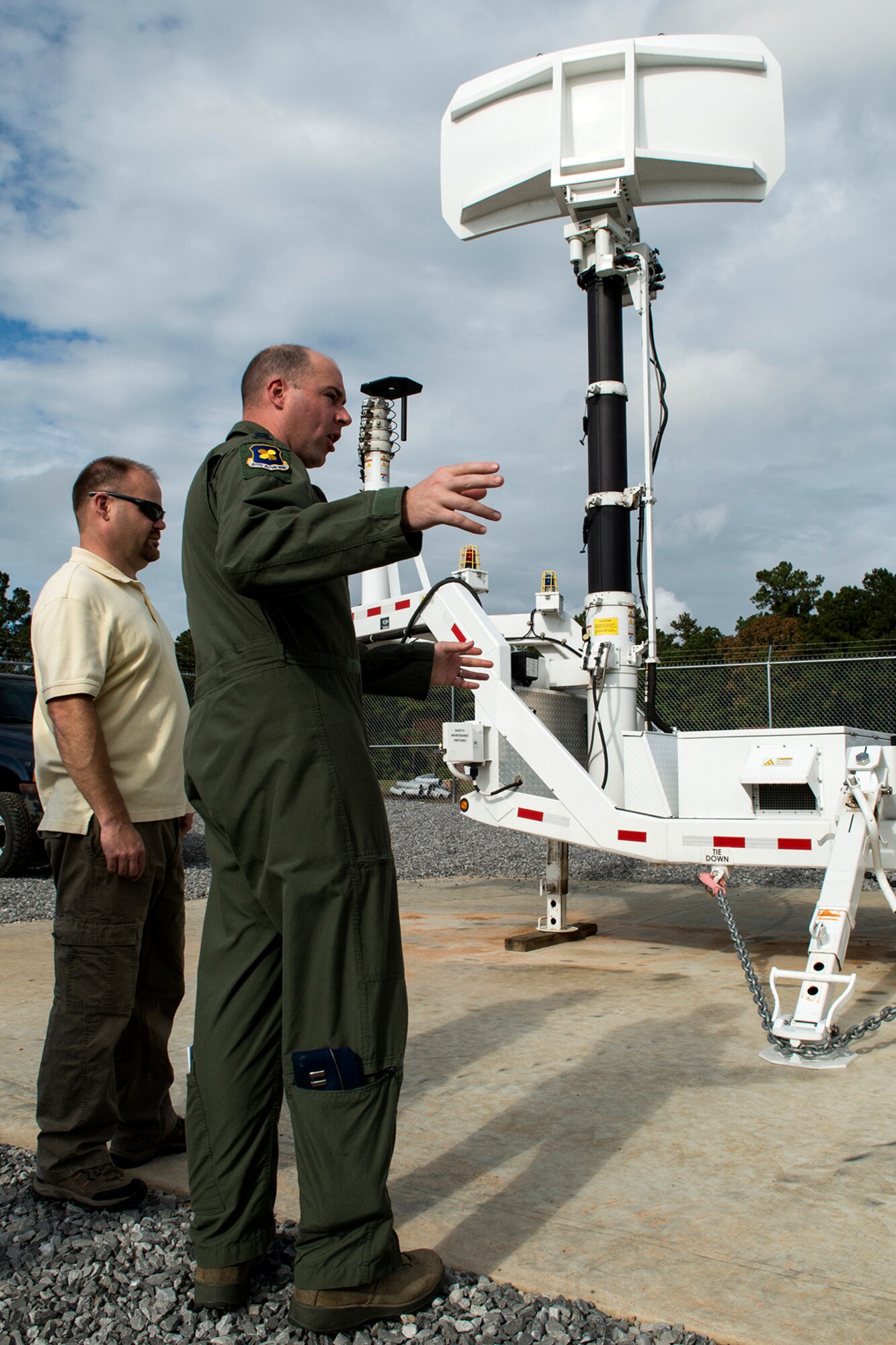 U.S. Air Force Capt. Andrew Riepe, 307th Bomb Wing Flight Safety Officer, gets a closer look at the Joint Threat Emitter (JTE) following its test at the Claiborne Bombing and Gunnery Range, Nov. 6, 2013, Alexandria, La. The JTE went live against a 93rd Bomb Squadron B-52H Stratofortress by simulating enemy surface-to-air missile threats. (U.S. Air Force photo by Master Sgt. Greg Steele/Released)