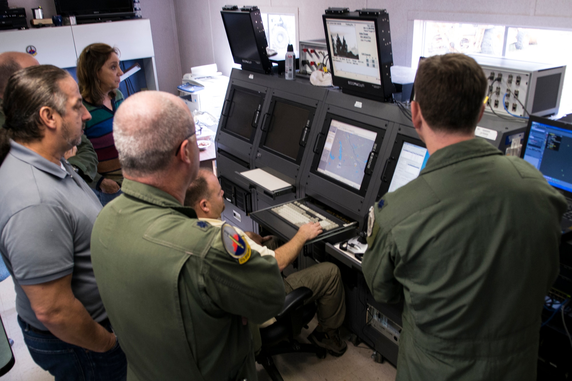 Members of the 307th Operations Support Flight watch as the Joint Threat Emitter (JTE) is used for the first time against a 93rd Bomb Squadron B-52H Stratofortress at the Claiborne Bombing and Gunnery Range, Nov. 6, 2013, Alexandria, La. The system will be used to train B-52 Electronic Warfare Officers to protect their aircraft during a threat of a missile attack. (U.S. Air Force photo by Master Sgt. Greg Steele/Released)