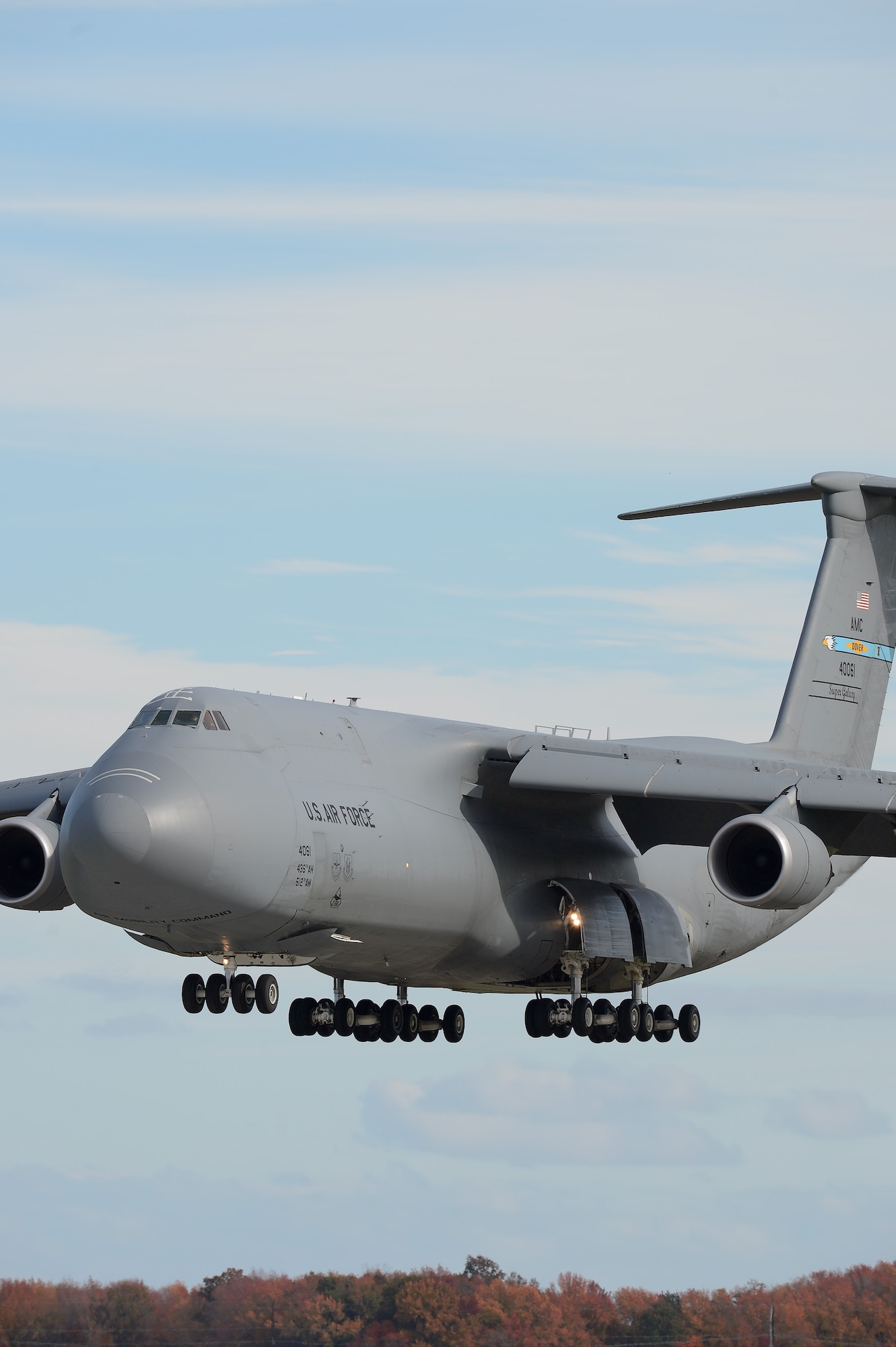 A C-5M Super Galaxy from the 9th Airlift Squadron, 436th Airlift Wing, is seen on final approach as the crew from the 9th Airlift Squadron conducts aircrew proficiency training Nov. 4, 2013, at Dover Air Force Base, Del. Dover is home to the entire active M-model fleet and the aircraft are routinely called upon to airlift outsized cargo in an efficient manner. (U.S. Air Force photo/Greg L. Davis)