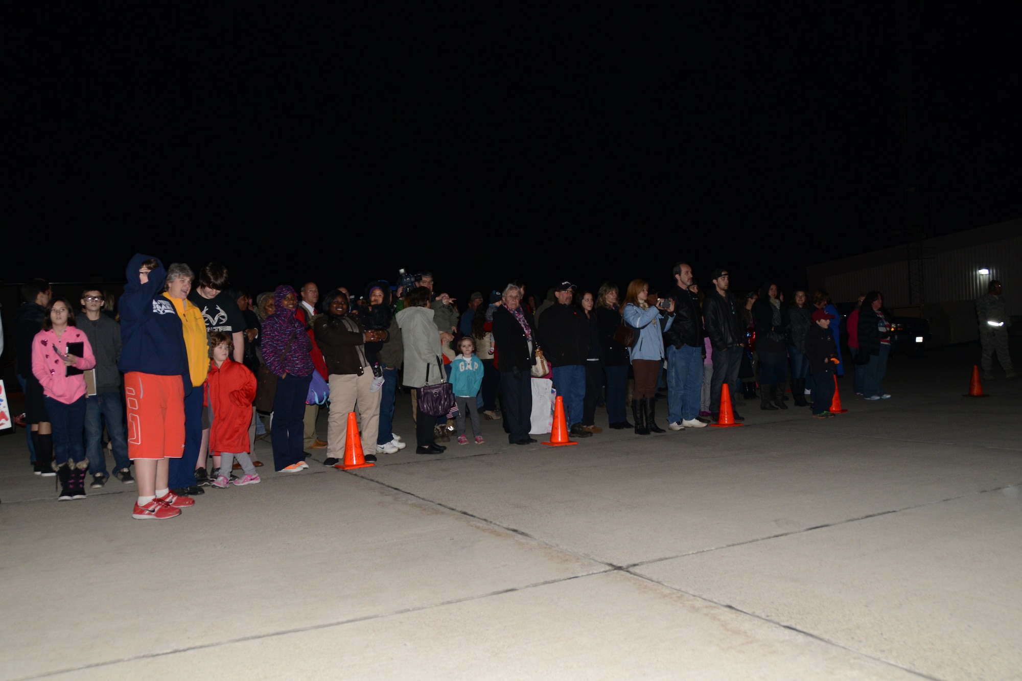 Family members wait along the flight line as the 107th Airlift Wing’s Airmen return from Southwest Asia Nov. 7, 2013. (U.S. Air National Guard Photo/Senior Master Sgt. Ray Lloyd)