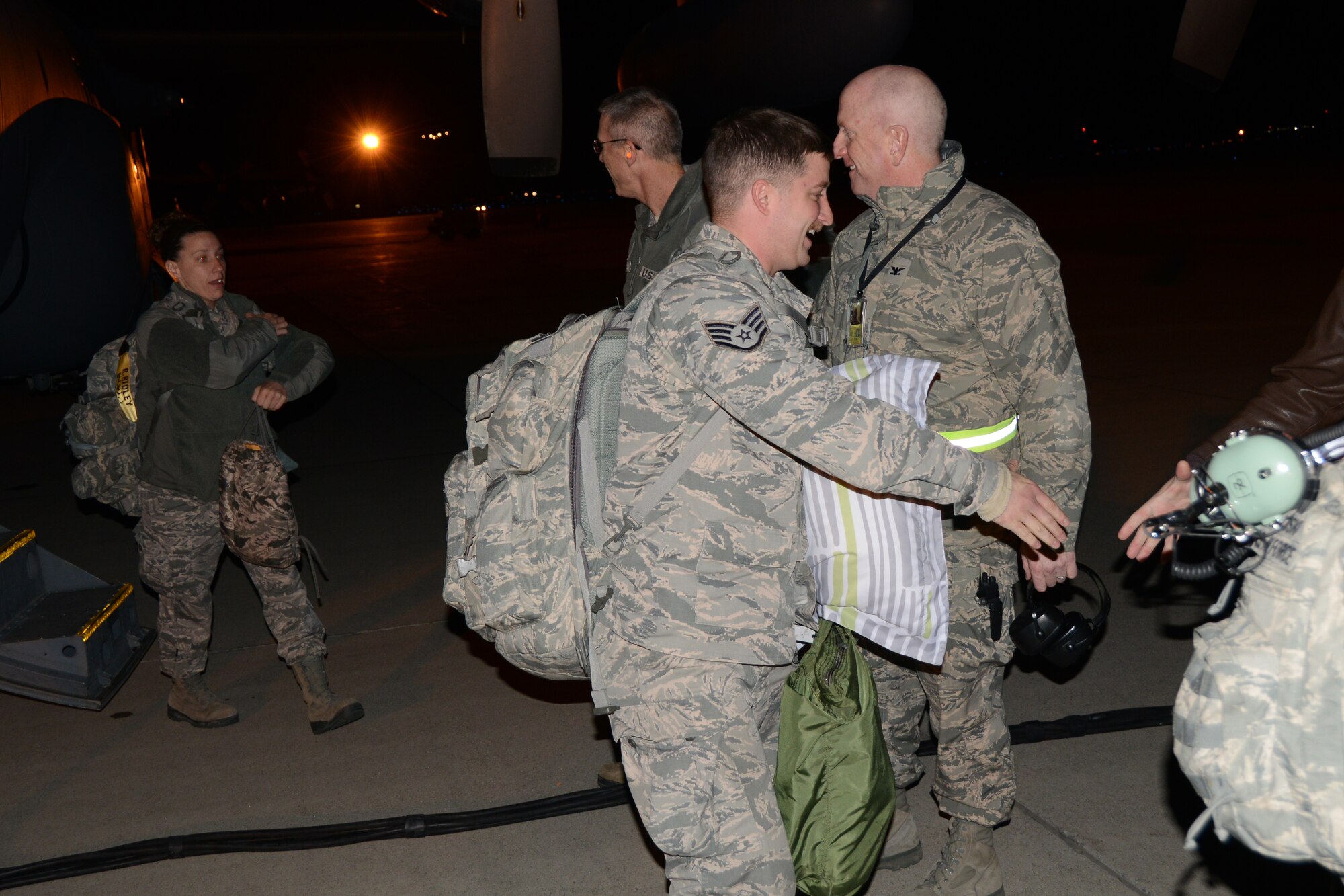 107th Airlift Wing returns from Southwest Asia. Col. Robert Kilgore, Vice Commander and Col. Kevin Rogers, Maintenance Group Commander greets their airmen as they come off the C-130 aircraft. Nov. 7, 2013. (U.S. Air National Guard Photo/Senior Master Sgt. Ray Lloyd)