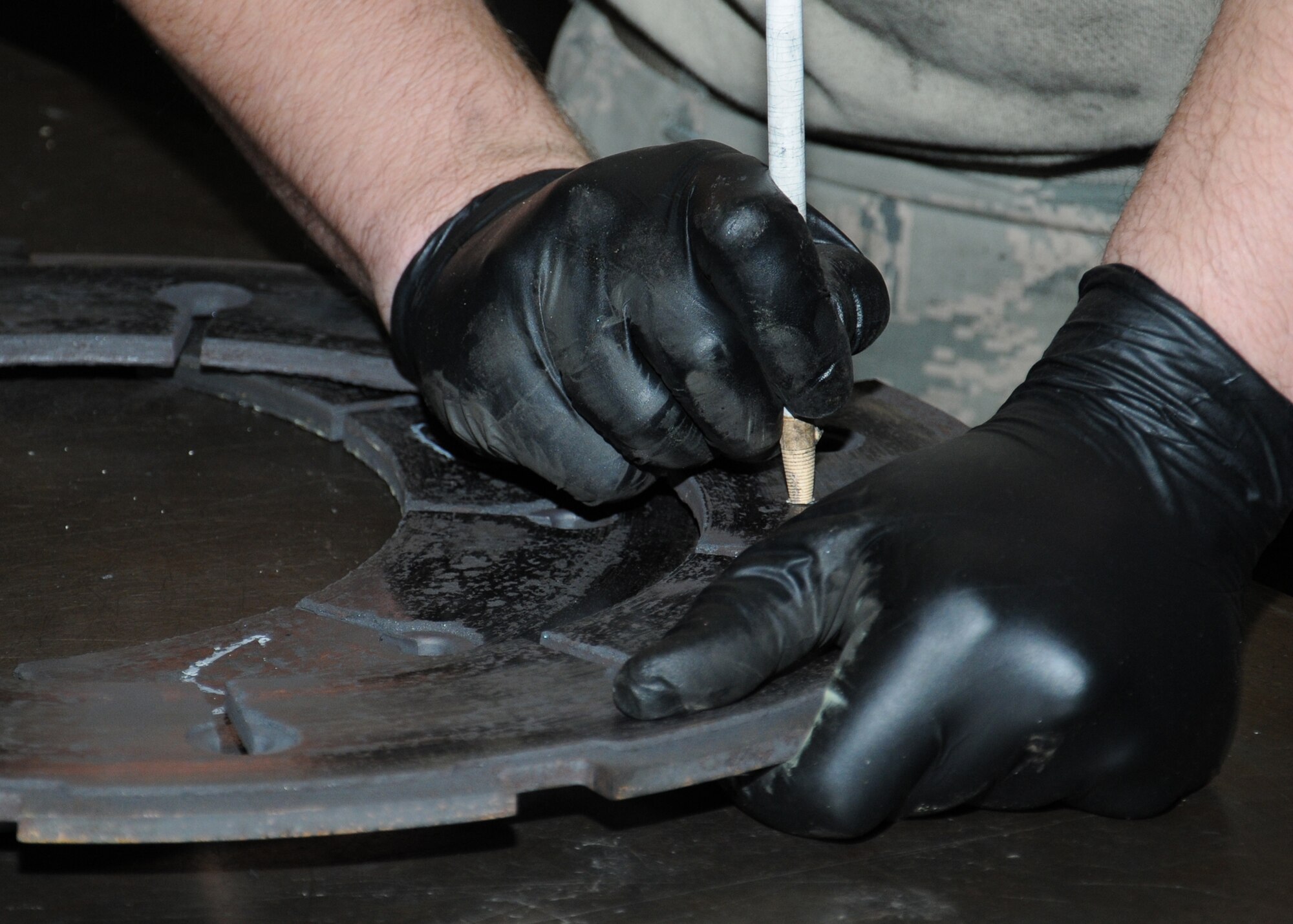 U.S. Air Force Senior Airman Casey Jackson, 100th Maintenance Squadron aircraft hydraulics systems journeyman from Columbus, Ohio, disassembles a C-130 brake in order to overhaul it and ensure it’s serviceable to be reused on an aircraft Nov. 1, 2013, on RAF Mildenhall, England. The 100th MXS hydraulics backshop personnel’s main role is to overhaul parts for all the aircraft on RAF Mildenhall. The personnel also build hydraulic hoses and are trained to build hoses for everything from aircraft to security barriers on RAF Mildenhall. (U.S. Air Force photo by Gina Randall/Released)