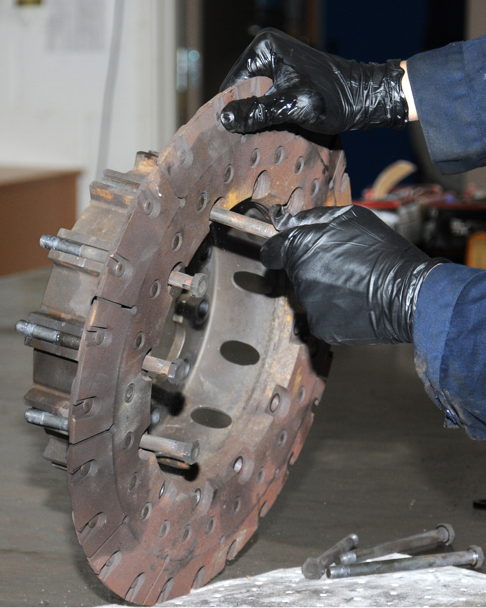 U.S. Air Force Tech. Sgt. Eric Vangsness, 100th Maintenance Squadron hydraulics backshop assistant section chief from Decorah, Iowa, disassembles a C-130 brake in order to overhaul it and ensure it’s serviceable to be reused on an aircraft Nov. 1, 2013, on RAF Mildenhall, England. The 100th MXS hydraulics backshop personnel’s main role is to overhaul parts for all the aircraft on RAF Mildenhall. The personnel receive a part, completely disassemble every nut and bolt, inspect it, replace all worn components, re-assemble it, test it, then send it back out to be fitted to an aircraft. (U.S. Air Force photo by Gina Randall/Released)